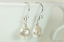 Sterling silver wire wrapped white flat coin pearl dangle earrings handmade by Jessica Luu Jewelry