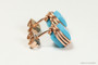 Side view of 14K rose gold filled wire wrapped turquoise blue faceted cube crystal studs handmade by Jessica Luu Jewelry