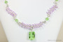 Sterling silver wire wrapped necklace with peridot light green and lavender light purple crystals handmade by Jessica Luu Jewelry