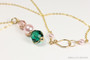 14K yellow gold filled three stone pendant with 6mm vintage rose crystal, 8mm rosaline pink pearl, 10mm emerald green crystal on chain necklace handmade by Jessica Luu Jewelry