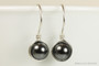 Sterling silver wire wrapped black pearl drop earrings handmade by Jessica Luu Jewelry
