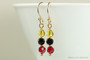 14K yellow gold filled wire wrapped dangle earrings with yellow red and black crystals handmade by Jessica Luu Jewelry