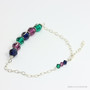 Sterling silver wire wrapped chain bracelet with green purple blue crystals handmade by Jessica Luu Jewelry