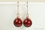 14K rose gold filled dangle earrings with 10mm dark red burgundy pearls handmade by Jessica Luu Jewelry