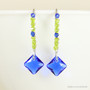 Sterling silver beaded dangle earrings with chartreuse green crystals and cobalt blue Austrian crystal drops handmade by Jessica Luu Jewelry