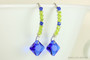 Sterling silver beaded dangle earrings with chartreuse green crystals and cobalt blue Austrian crystal drops handmade by Jessica Luu Jewelry