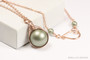 12mm sage green pearl solitaire pendant wrapped in 14K rose gold filled wire and hung on 18 inch long chain necklace handmade by Jessica Luu Jewelry