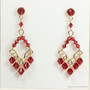 Ruby red Austrian crystal chandelier earrings wrapped  in 14K yellow gold filled wire handmade by Jessica Luu Jewelry
