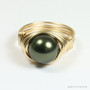 10mm dark olive green pearl solitaire ring in 14K yellow gold filled wire wrapped setting and band handmade by Jessica Luu Jewelry