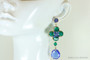 14K yellow gold filled earrings with faceted round emerald green Austrian crystals and sapphire blue teardrop shaped Austrian crystal dangles handmade by Jessica Luu Jewelry