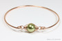 14K rose gold filled wire wrapped bangle bracelet with 10mm olive pearl solitaire handmade by Jessica Luu Jewelry