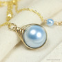 12mm light blue pearl solitaire in 14K yellow gold filled wire wrapped setting on 18 inch long chain necklace handmade by Jessica Luu Jewelry