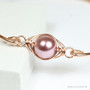 14K rose gold filled bangle bracelet with 10mm blush pink pearl solitaire handmade by Jessica Luu Jewelry