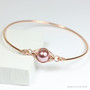 14K rose gold filled bangle bracelet with 10mm blush pink pearl solitaire handmade by Jessica Luu Jewelry