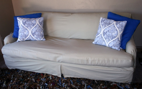 Separate Seat t-cushion slipcover with accent pillows.