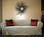 Tie arm slipcover in dessert sand velvet with accent pillows.
