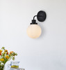 Living Disrict LD7030W8BK Hanson 1 light bath sconce in black with frosted shade