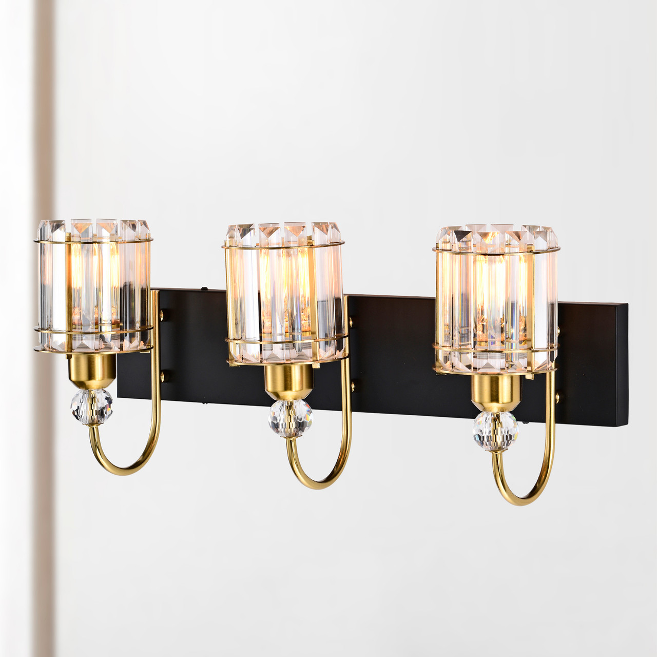 WAREHOUSE OF TIFFANY'S 3001/3W Gambit 22 in. 3-Light Indoor Matte Black and Brass Finish Wall Sconce with Light Kit