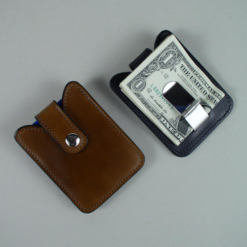 Money clip on back holds both Canadian and American bills.
