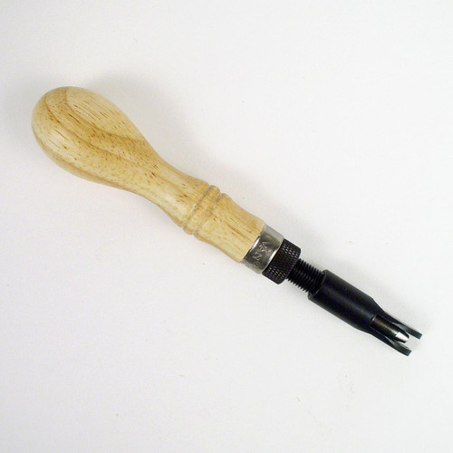 The depth of the U gouge in the leather can be adjusted by turning the knurled collar on this leatherworking tool. 