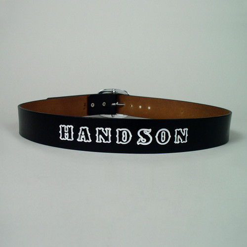 Custom leather belt with imprinted name in white lettering.