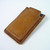 Natural oil color leather smartphone case with open top.