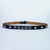 Personalized studded leather belt with white lettering and diamond studs.