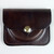 Plain brown leather change purse molded to shape.