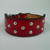 Red thick leather dog collar studded with silver round studs.