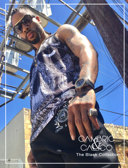 Hip Hop Artist Chuckwavy posing in a The Skull Tank Top from The Black Collection