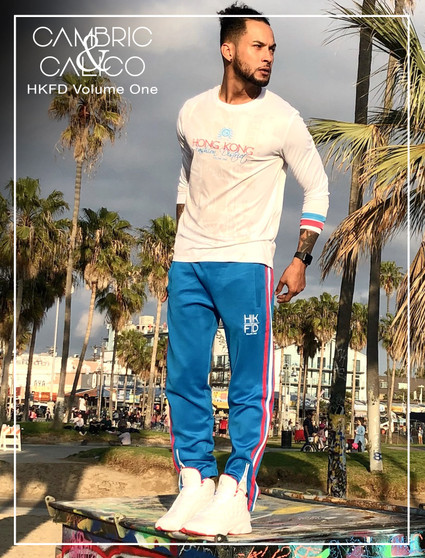 Model Carlos Standing Tall in The HKFD Blue Striped Sweatpants