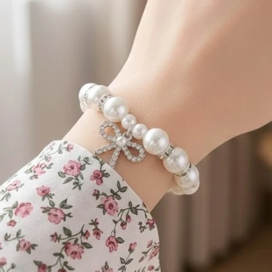 Pearl Bow Charm Stretch Bracelet .70 each