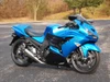 Brocks Performance Brocks Alien Head 2 Full Exhaust 14" Muffler Kawasaki ZX14R (12-25), blue sport motorcycle with aftermarket exhaust system in an outdoor parking lot.