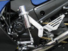 Pingel Easy Shift Electric Shifter Universal Kit For 7/8" Handlebars, close-up of the motorcycle's mechanical shifter and handlebar components. Pingel Easy Shift Electric Shifter Universal Kit For 7/8" Handlebars, close-up of the motorcycle's mechanical shifter and handlebar components.