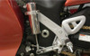 Pingel Easy Shift Electric Shifter Universal Kit For 1" Handlebars, close-up view of the motorcycle's gear shifter mechanism installed on the handlebar with metallic and white components.