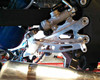DME Rear Sets for Kawasaki ZX14R (06-26), motorcycle rear foot pegs and foot controls installed on the bike's frame.