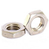 Schnitz Racing Schnitz Clutch Lockup Lightweight 6mm Nut Kit, close-up view of two metallic nuts with inner threading suitable for clutch lockup. Schnitz Racing Schnitz Clutch Lockup Lightweight 6mm Nut Kit, close-up view of two metallic nuts with inner threading suitable for clutch lockup.