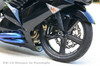 Brocks Performance Brocks Brake Caliper Delete Spacer Set Black, close-up view of a motorcycle's front wheel with black brake caliper delete spacer set, black carbon fiber wheel, and black fender.