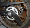 Tiger Racing License Plate Bracket Swingarm Mount Kawasaki ZX14, close-up view of the black metal license plate bracket attached to the rear wheel swingarm of a Kawasaki ZX14 motorcycle.