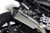 Brocks Performance Brocks CT Single Full Exhaust 16" QuietKore Muffler for BMW S1000RR 2015-2019 and S1000R 2017-2020, close-up view of the motorcycle's exhaust system with a carbon fiber tip and sleek metallic body.