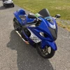 Montgomery Motorsports Carbon Fiber Motorcycle Parts Carbon Fiber Headlight Insert Suzuki Hayabusa (08-20), close-up view of a blue Suzuki Hayabusa motorcycle with carbon fiber headlight insert.