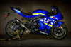 M4 Performance Exhausts M4 Tech1 Carbon Exhaust Suzuki GSXR1000 (17-25), blue motorcycle with M4 exhaust system in a studio setting.