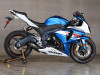 M4 Performance Exhausts M4 Street Slayer Carbon Exhaust Suzuki GSXR1000 (12-16), a blue and white sport motorcycle with carbon exhaust and racing tires.