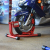 Baxley Scooter Chock, red motorcycle wheel stand securing a blue scooter for display or maintenance.