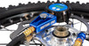 Motion Pro Digital Tire Pressure Gauge 0-60 psi, close-up of the digital tire pressure gauge measuring motorcycle tire pressure with hoses attached.