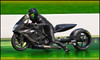 DME Air Ram Chain Tensioner Kit, motorcycle rider in black riding gear on a black racing motorcycle on the track.