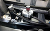 DME Air Oil Separator Tank – Carbon Fiber Catch Can, close-up view of the black carbon fiber catch can with aluminum fittings installed in a vehicle engine bay.