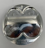 Wossner Piston Kit Suzuki GSXR1000 (17-25), aluminum piston components with clear protective covering, viewed from the top. Wossner Piston Kit Suzuki GSXR1000 (17-25), aluminum piston components with clear protective covering, viewed from the top.