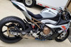 Brocks Performance Brocks CT Megaphone Full System with 17-inch Muffler on a BMW S1000RR motorcycle, showcasing a sleek motorcycle exhaust system with branding and a distinctive golden muffler.