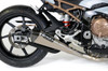 Brocks Performance Brocks CT Megaphone Full System w/17" Muffler BMW S1000RR (20-25), motorcycle exhaust system with a silver muffler and carbon fiber end cap installed on a BMW S1000RR motorcycle.
